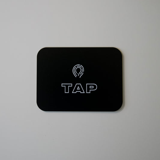 Close-up image of a Tap Networking NFC business card, featuring sleek design and embedded NFC chip for quick contact sharing in professional networking