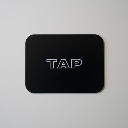 Close-up image of a Tap Networking NFC business card, featuring sleek design and embedded NFC chip for quick contact sharing in professional networking