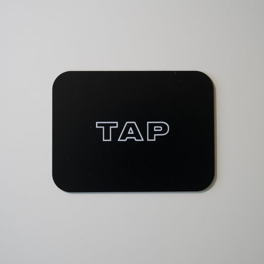 Close-up image of a Tap Networking NFC business card, featuring sleek design and embedded NFC chip for quick contact sharing in professional networking