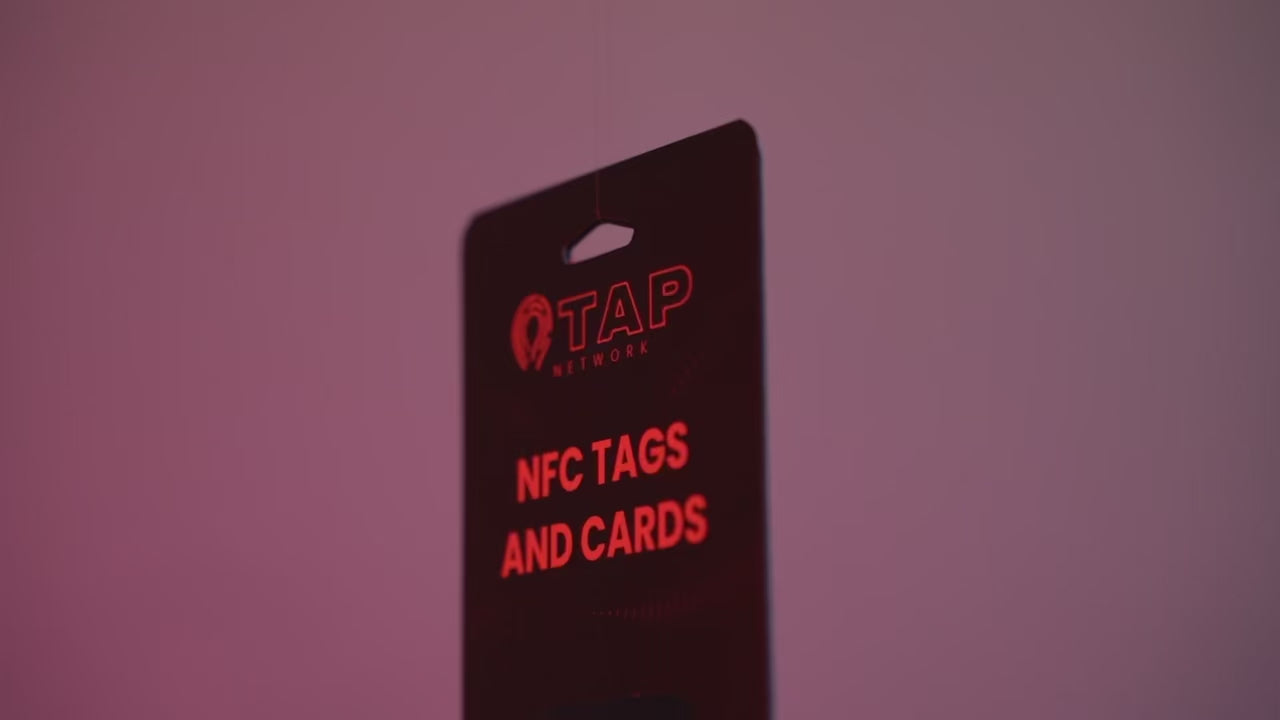 Load video: Video preview featuring a Tap Networking NFC tag fully packaged, set against a gradient purple background produced by Session Visuals.net, a video production company in Boise, Idaho.